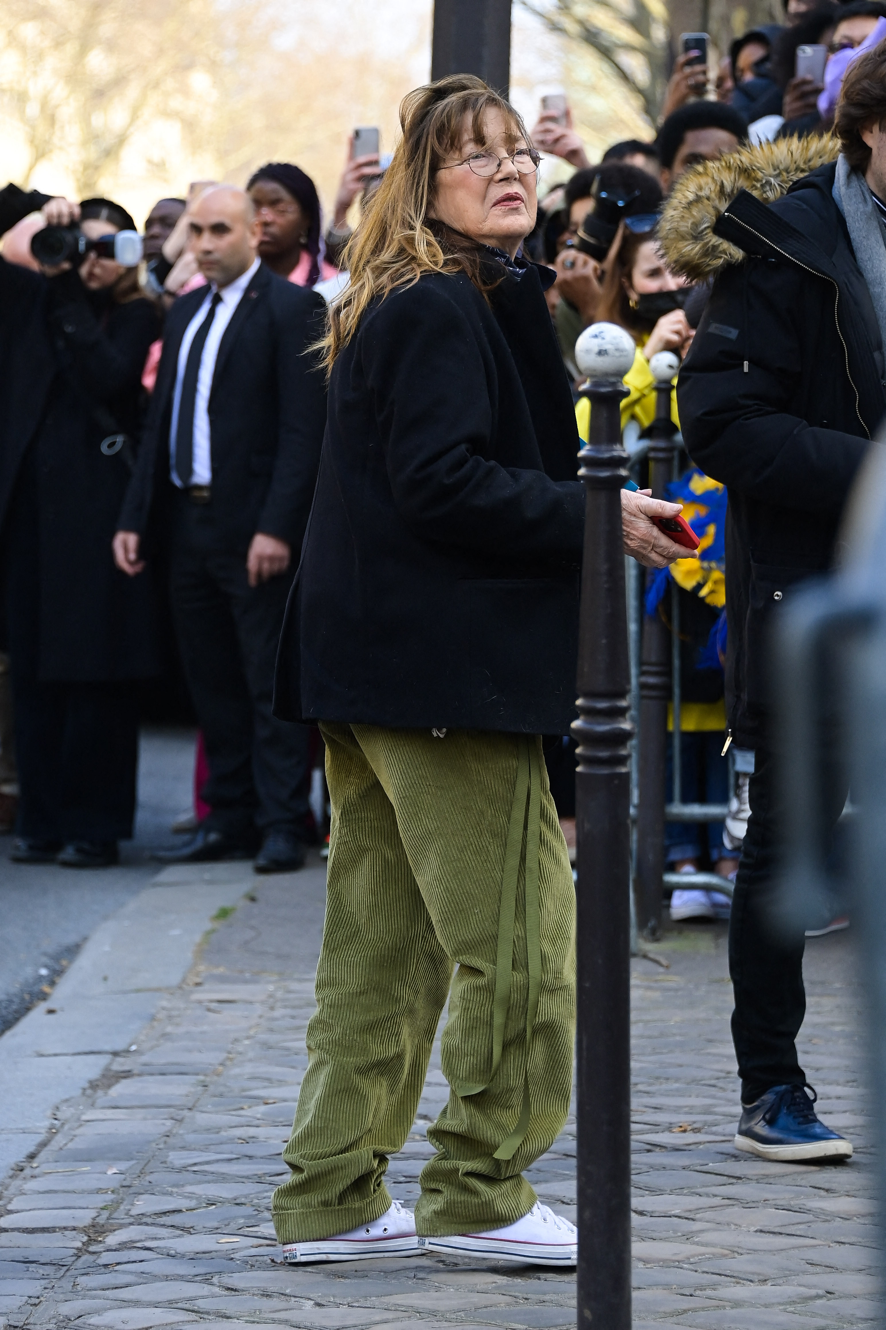 Jane Birkin recently in a Hermes desfilee holding her Birkin bag